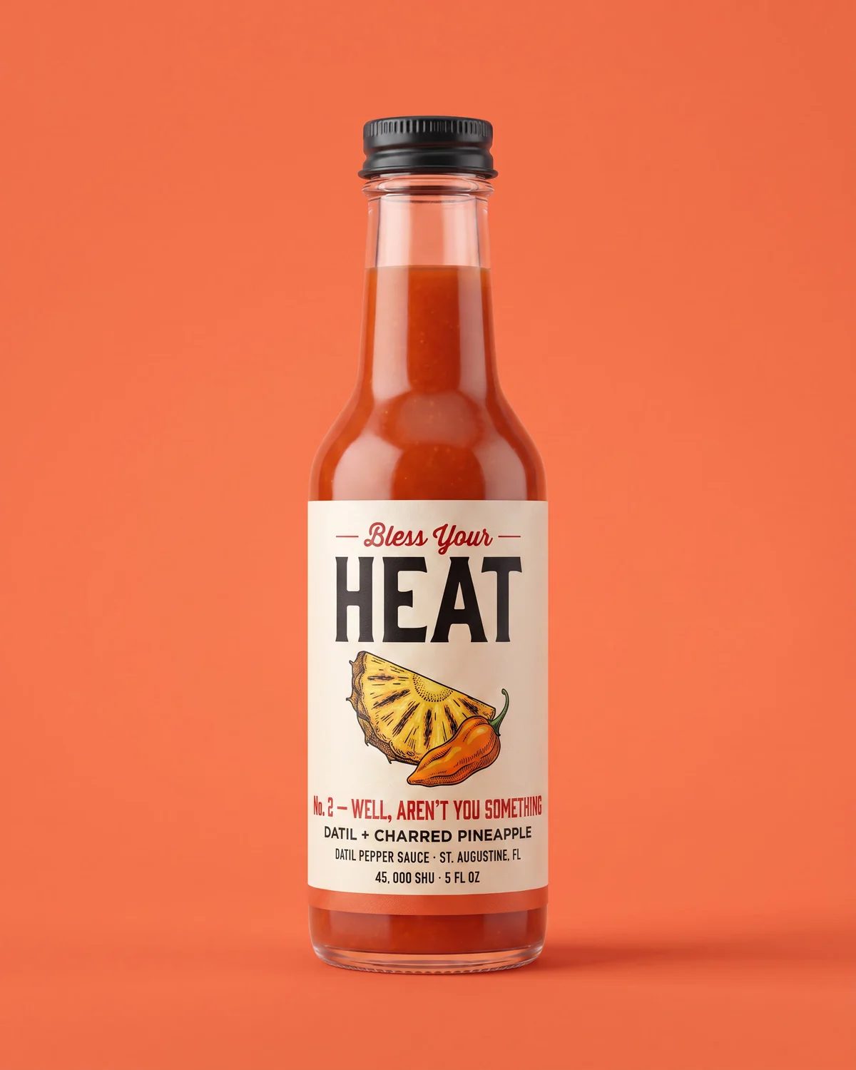 Well, Aren’t You Something bottle — golden-red charred pineapple sauce on a coral field.